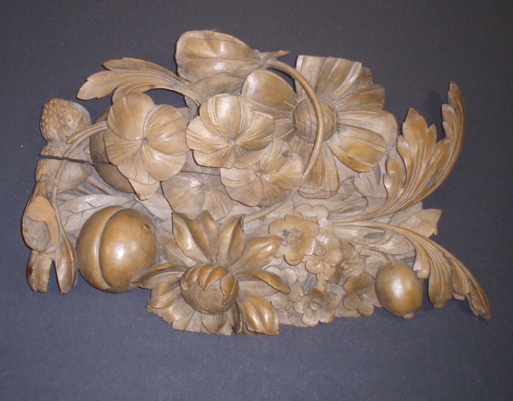 An ornate carved beech panel