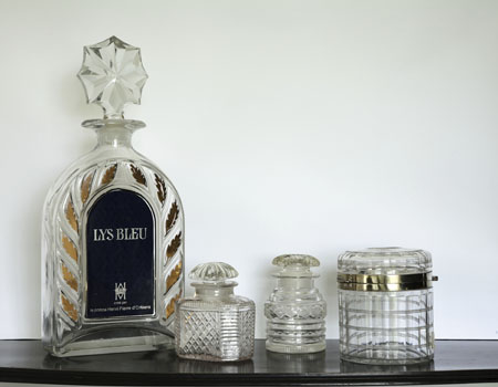 A large cut and moulded glass perfume bottle and stopper