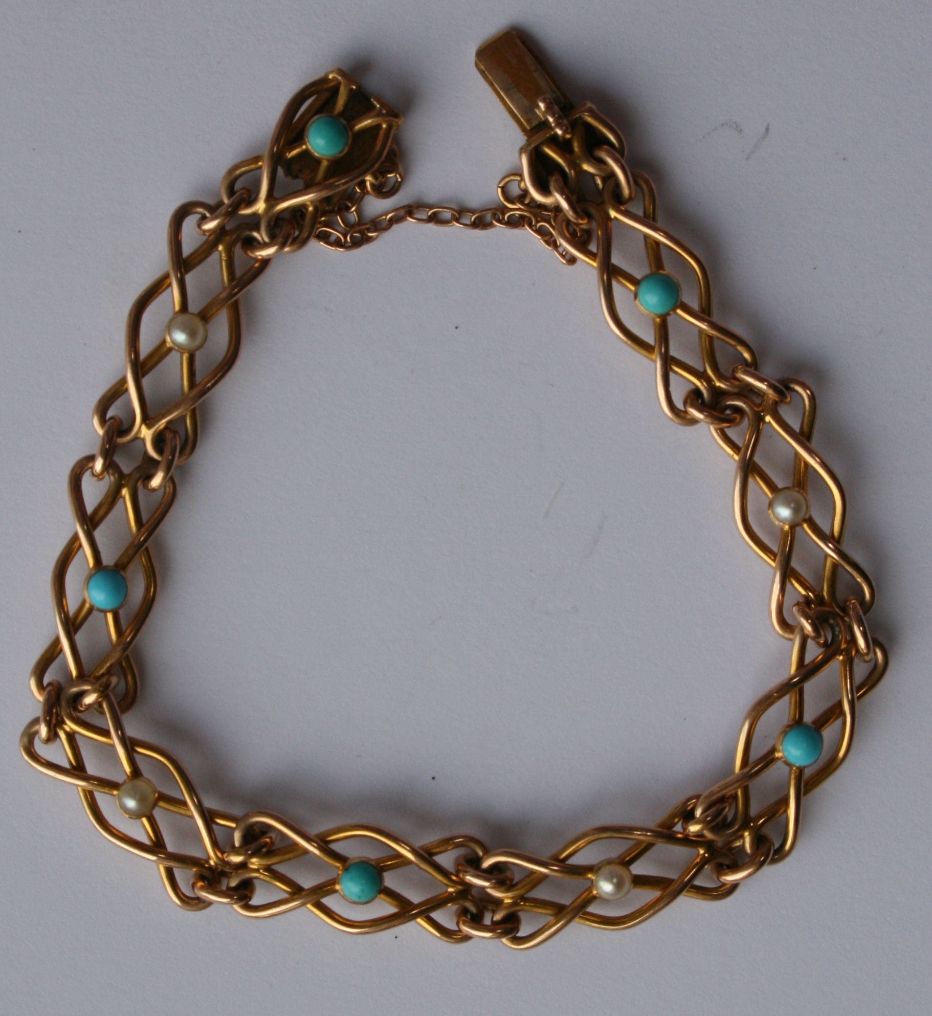An Edwardian gold turquoise and pearl bracelet