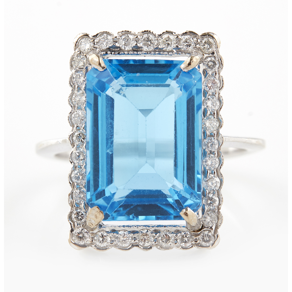 A blue topaz and diamond set cocktail ring