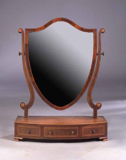 An Edwardian mahogany and boxwood strung toilet mirror