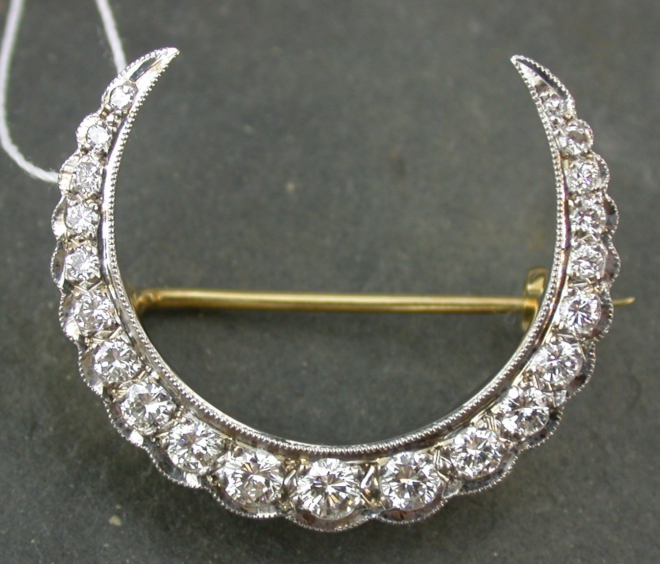 A diamond crescent brooch,