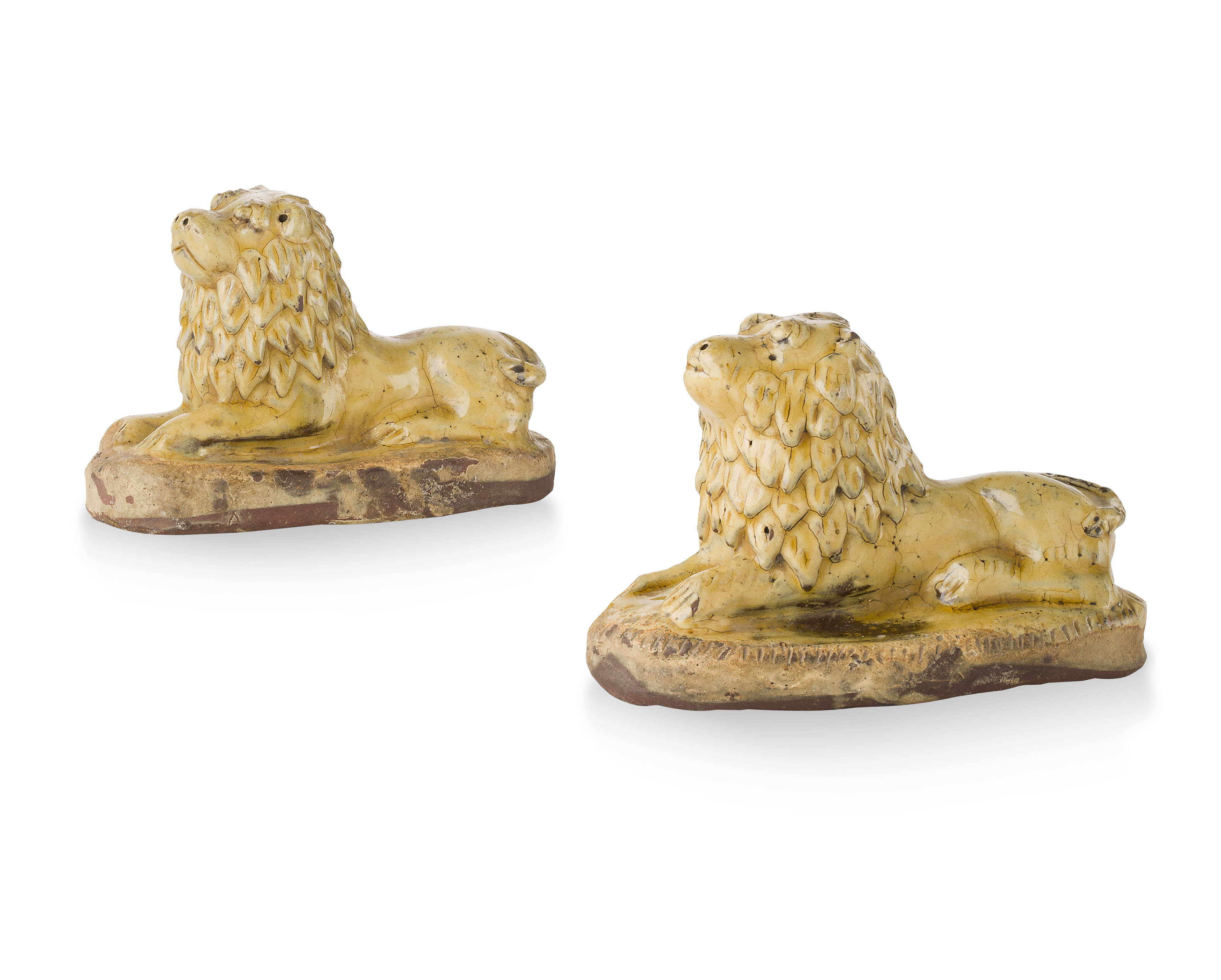 PAIR OF YELLOW GLAZED REDWARE FIGURES OF LIONS