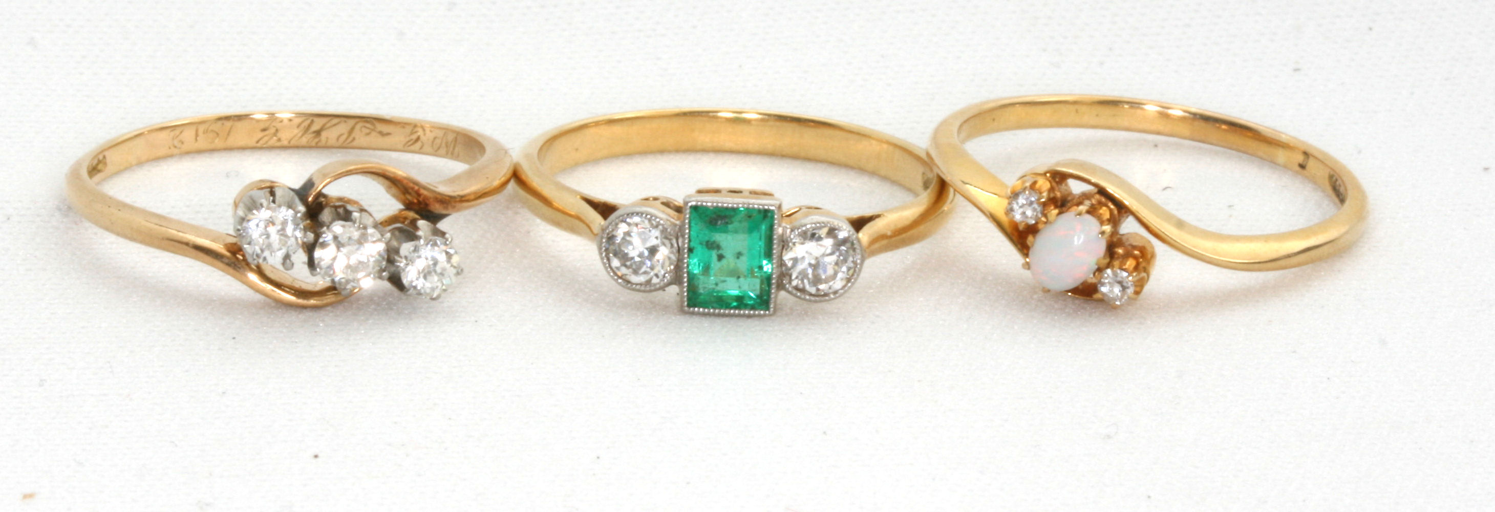 A group of three diamond and gem set rings