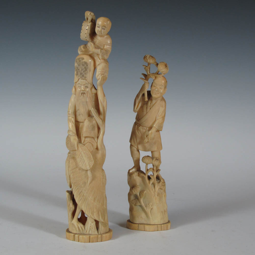 A Japanese carved ivory figure group Meiji period
