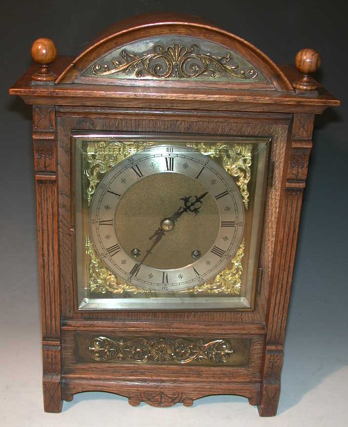 An oak mantel clock,