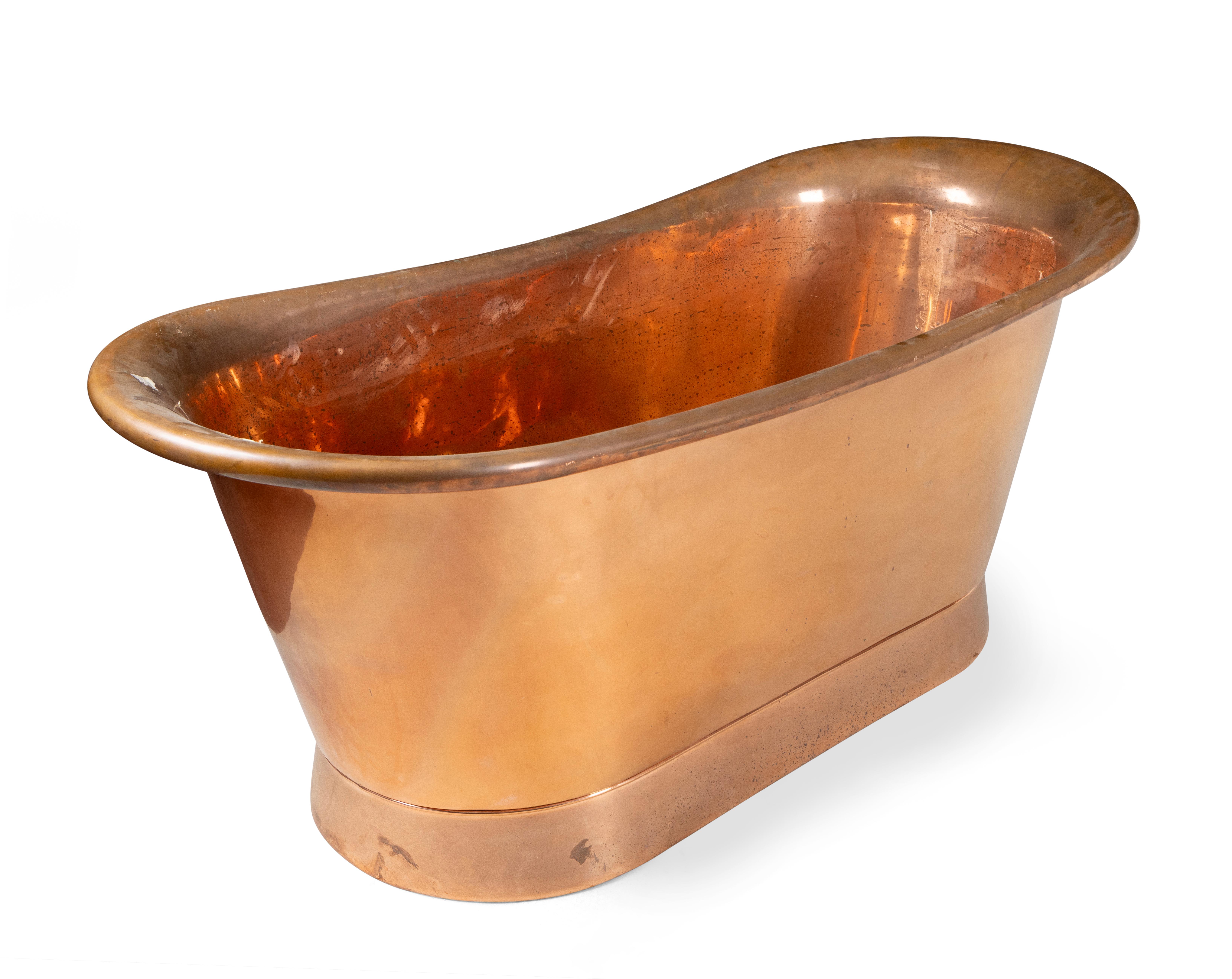 A ROUNDED RECTANGULAR ROLL TOP COPPER BATH