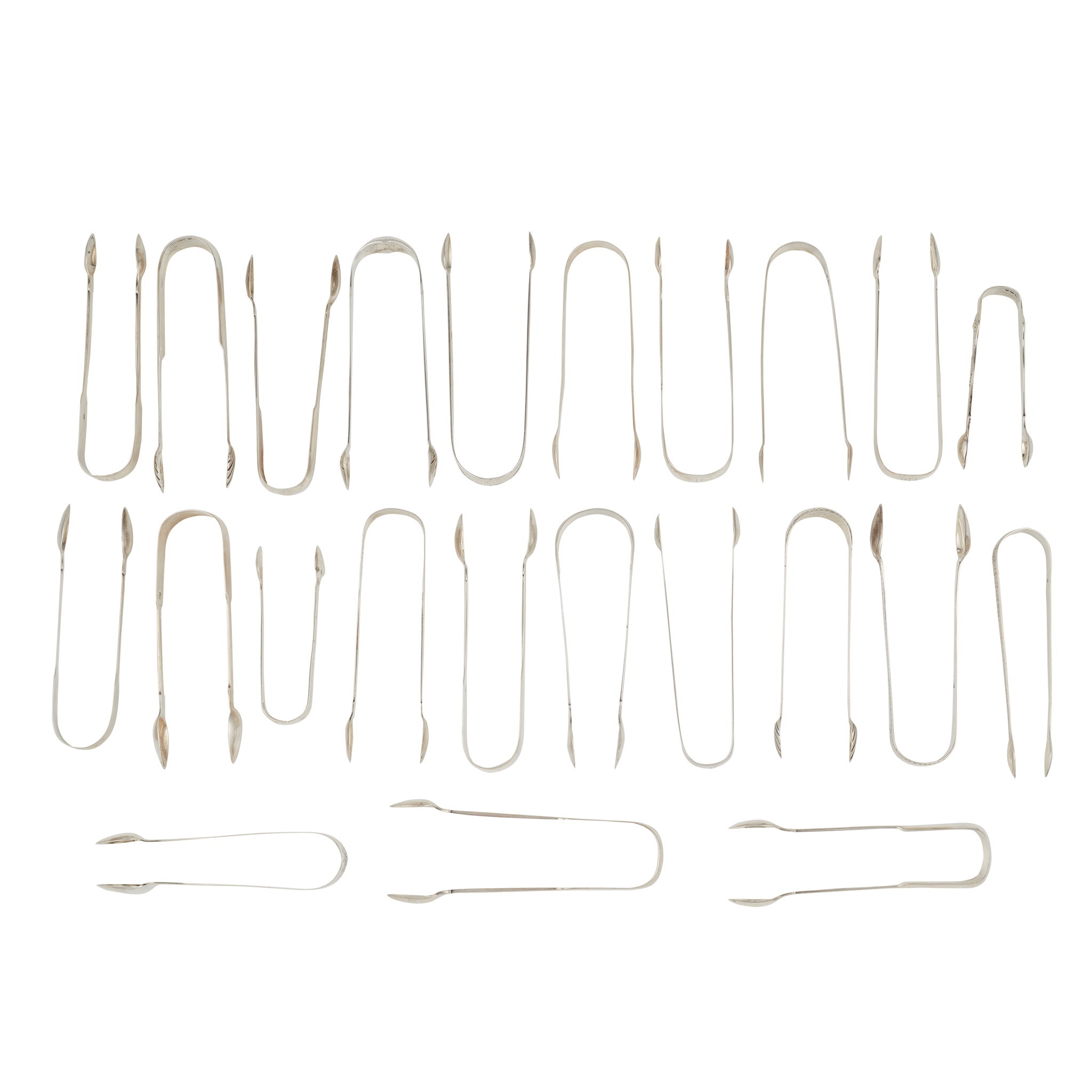 A group of twenty-three pairs of sugar tongs