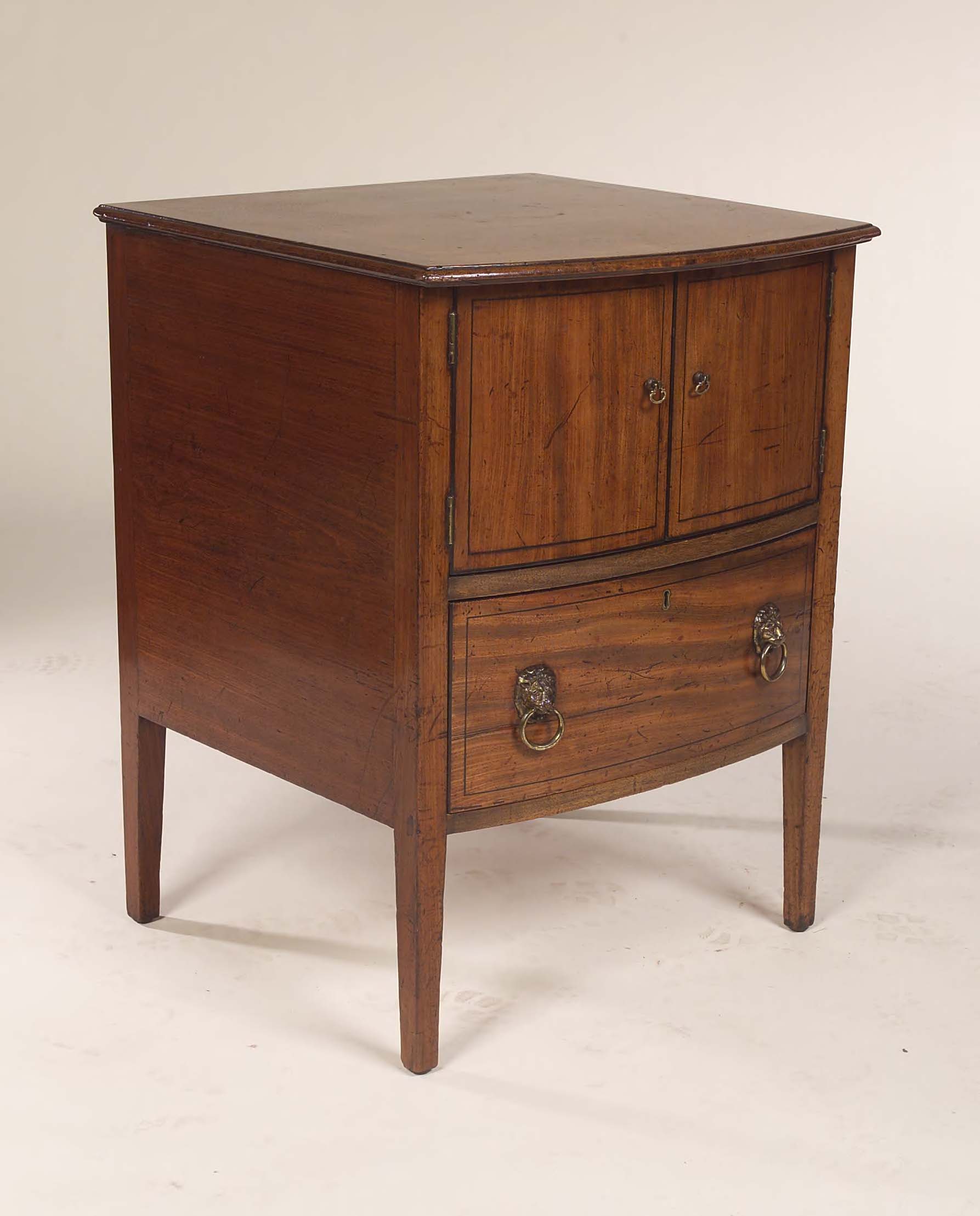 An early 19th century bedside cabinet,