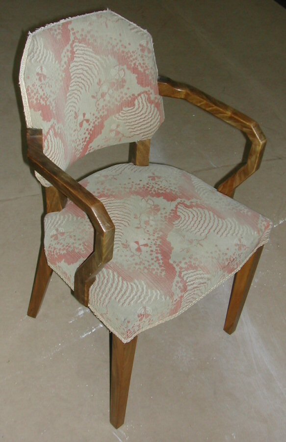 A set of four Art Deco walnut framed armchairs,