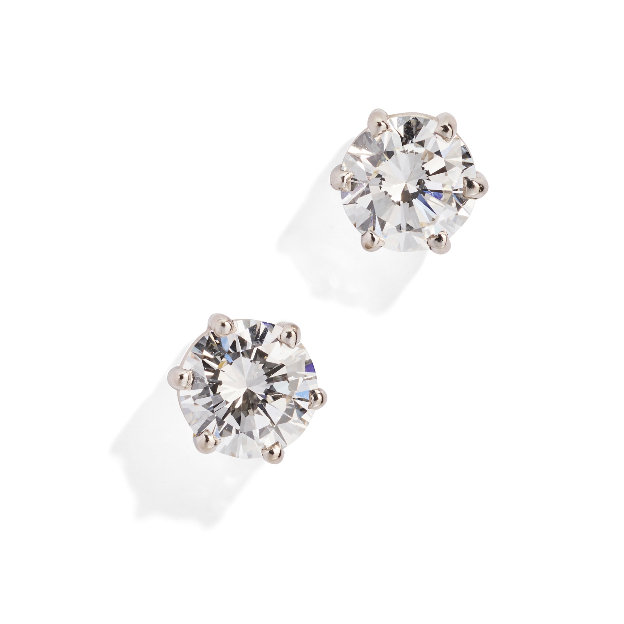 A pair of diamond single-stone earrings