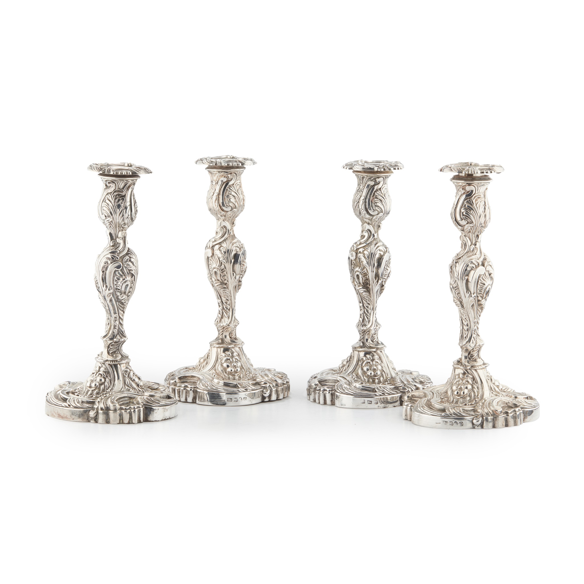 AMENDMENT A SUITE OF FOUR GEORGE III TABLE CANDLESTICKS AND A PAIR OF THREE LIGHT CANDELABRA