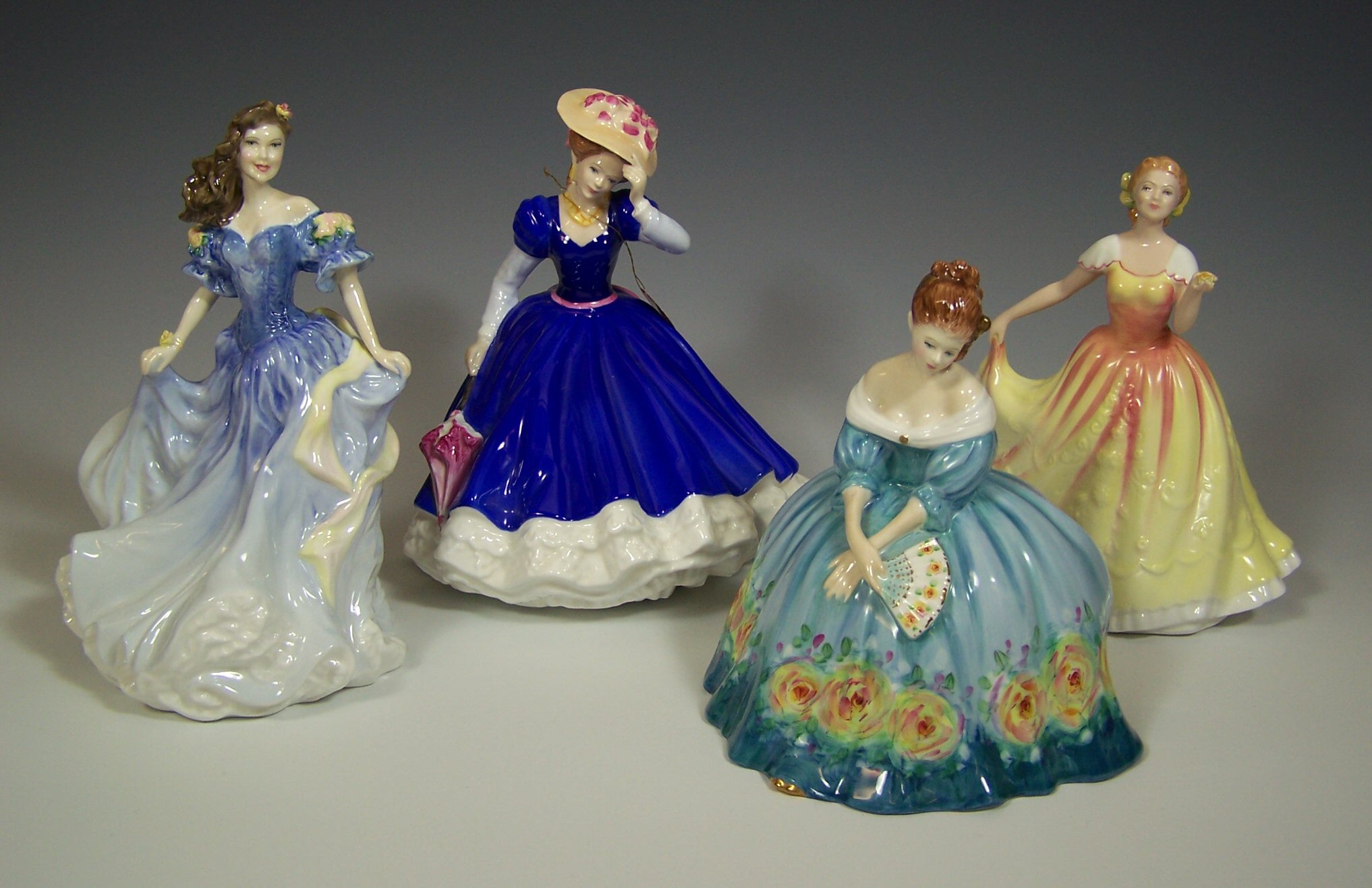 A collection of Royal Doulton figurines,