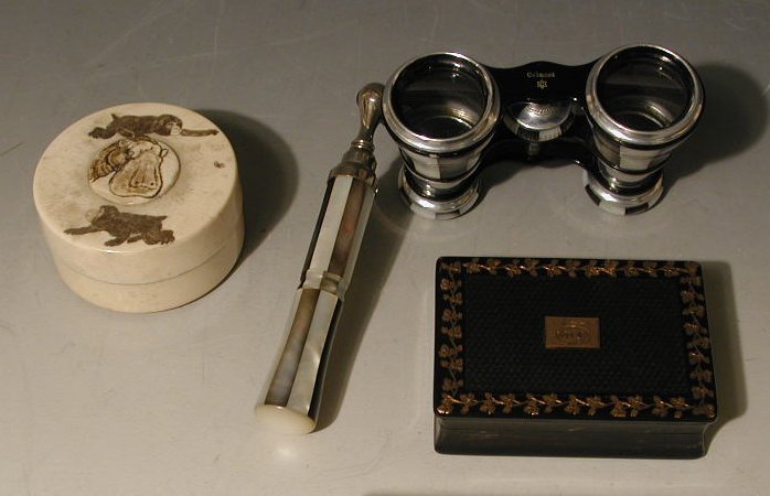 A black and gilt rectangular snuff box,