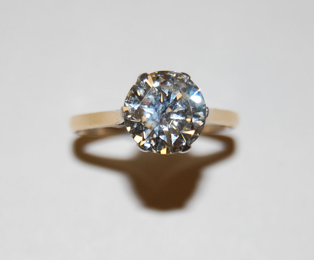 An 18ct gold and platinum mounted solitaire diamond ring