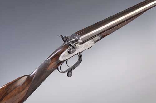 A James Purdey 12 bore under lever, side by side, hammer none ejector sporting gun