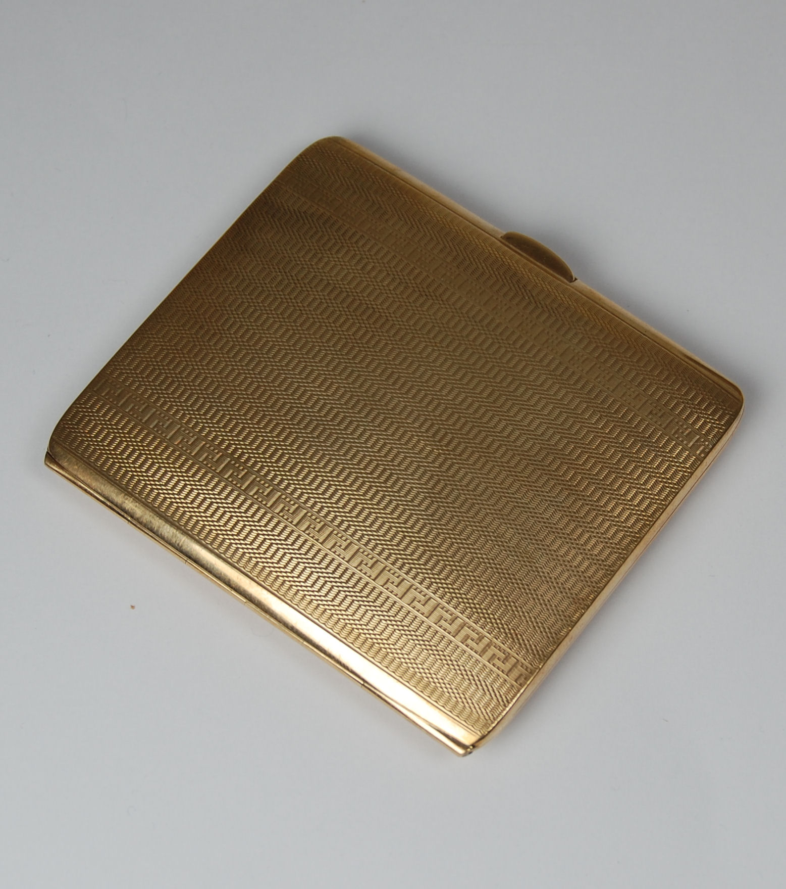A 9ct gold engine decoration cigarette case
