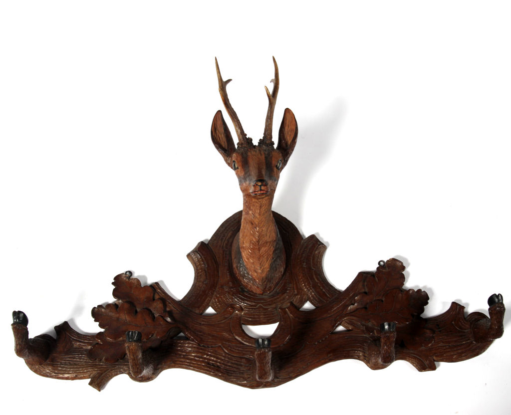 A late 19th century Swiss Black Forest carved coat rail
