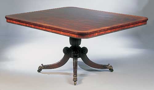 A Regency mahogany and burr elm inlaid breakfast table