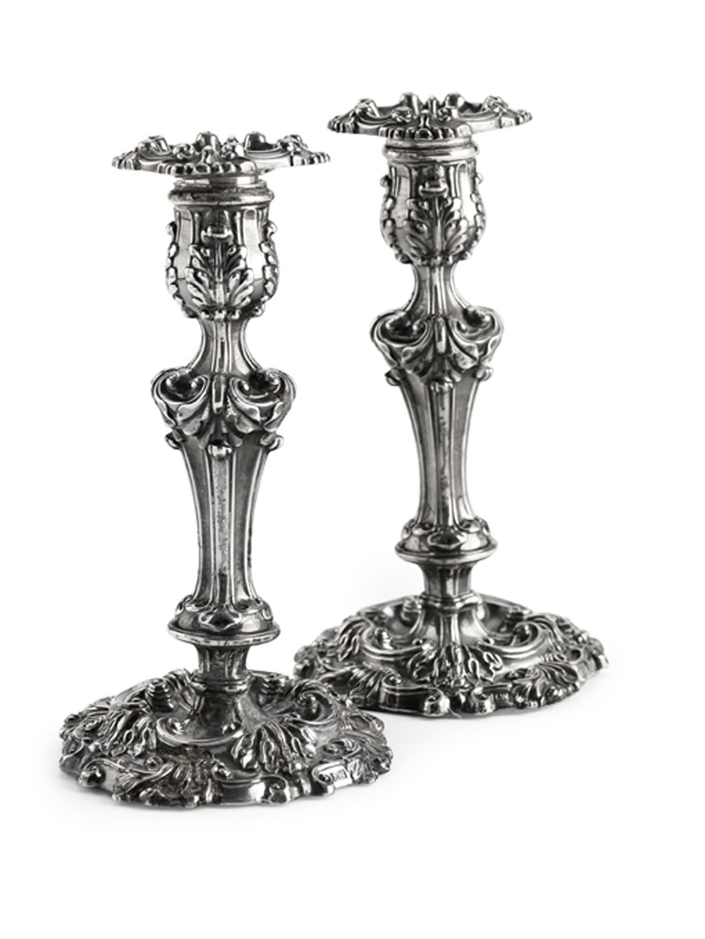 A pair of George IV candlesticks