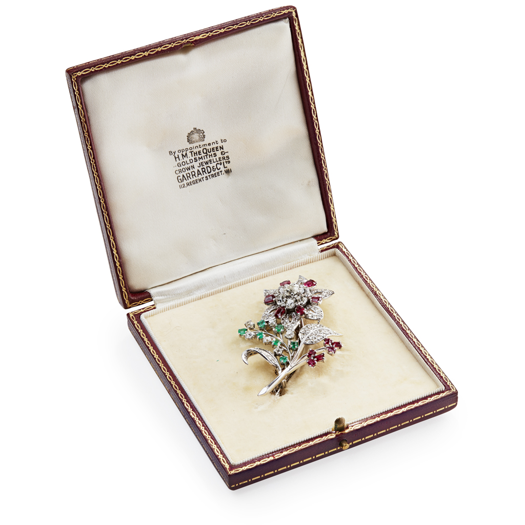 GARRARD & CO - A diamond, ruby and emerald set floral brooch
