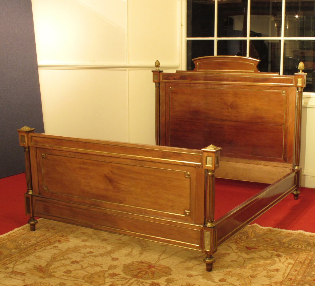 A French Empire style mahogany and brass mounted bed