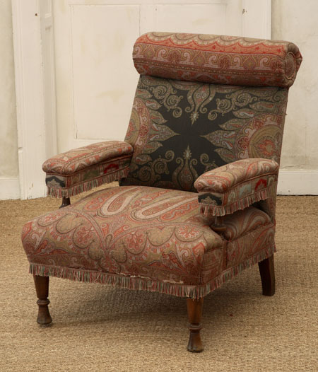 A Victorian mahogany and upholstered easy armchair