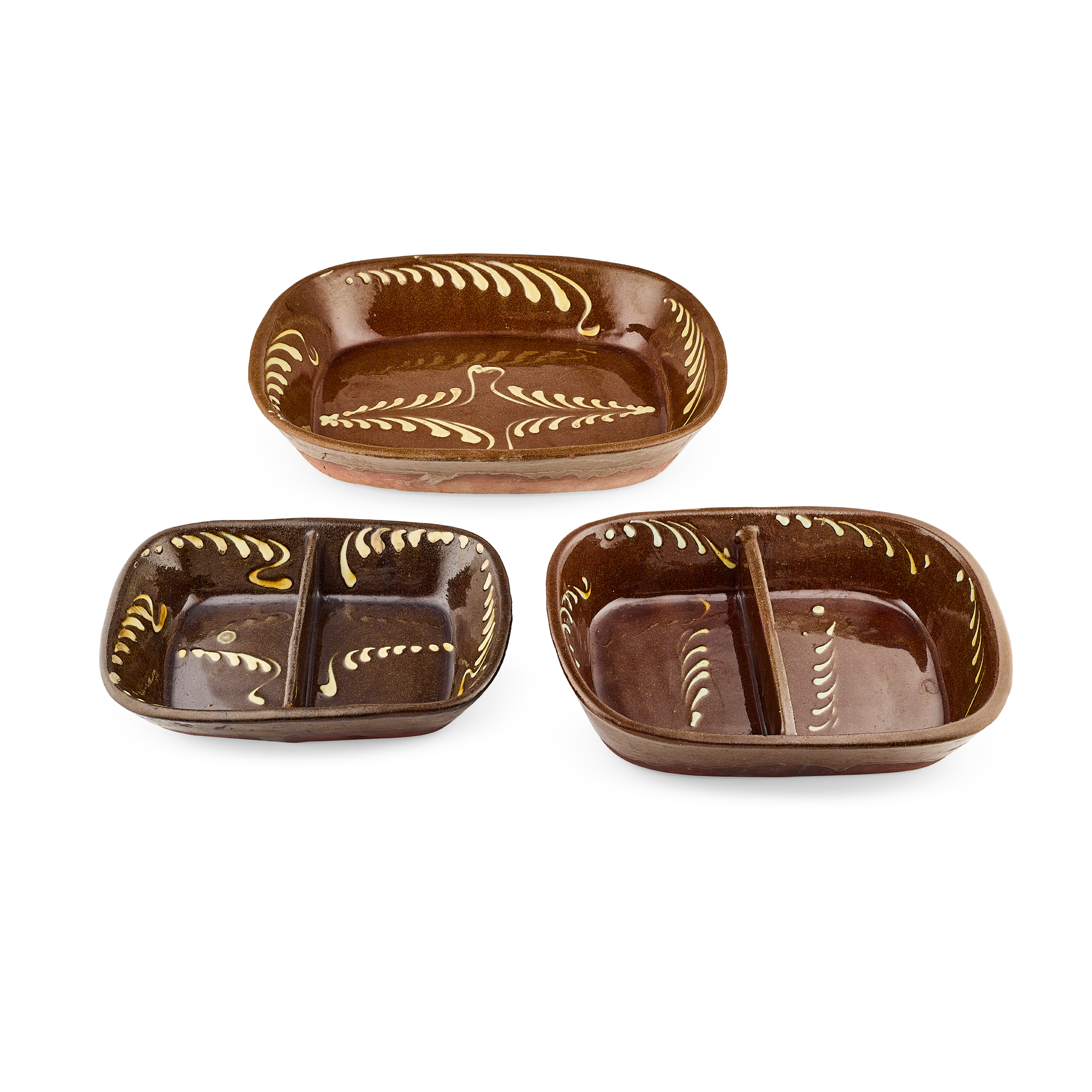 THREE ENGLISH GLAZED EARTHENWARE SLIPWARE DISHES