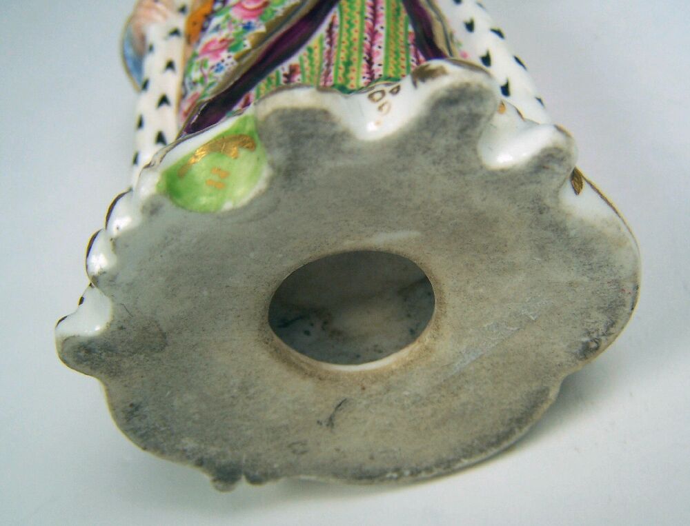 A pair of early 19th century English porcelain figures of Turks Possibly Rockingham