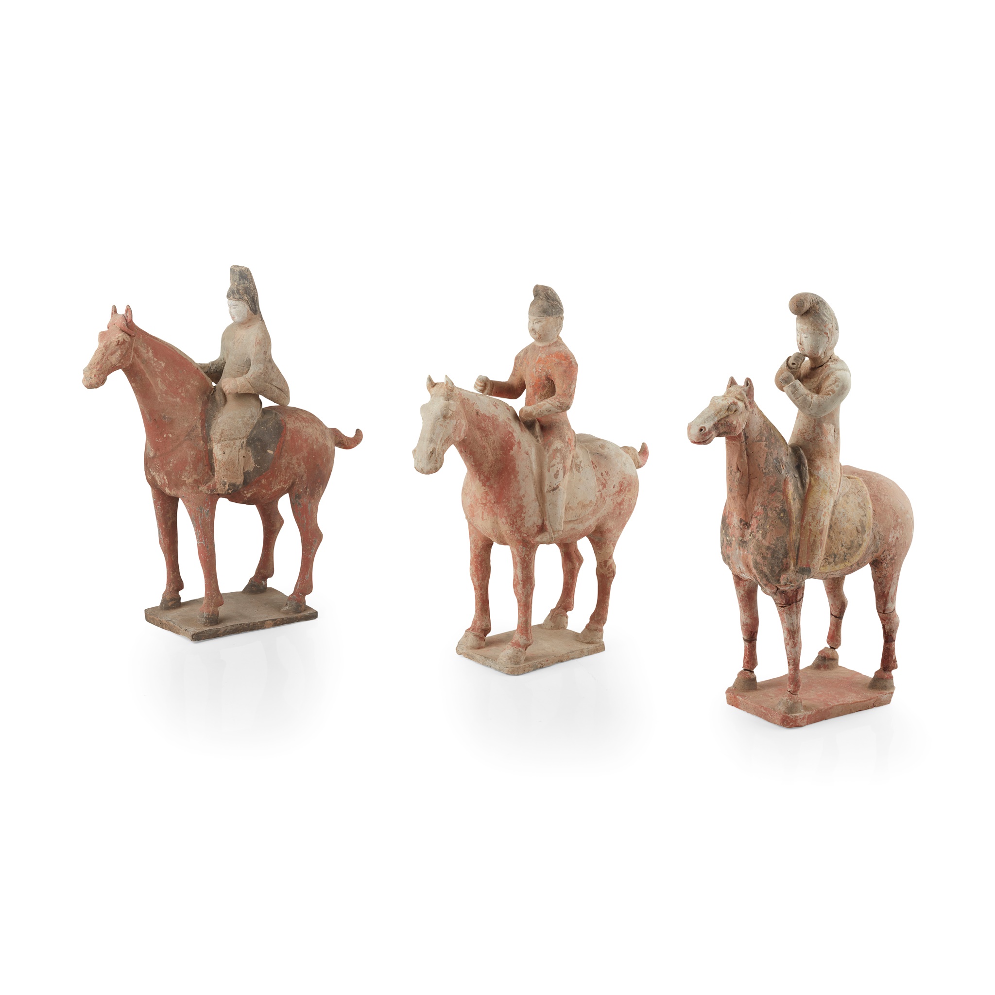 GROUP OF THREE PAINTED POTTERY HORSES AND RIDERS