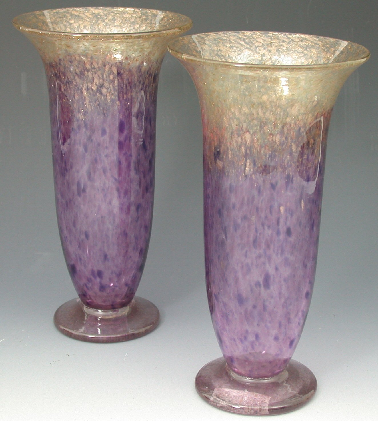 A pair of Monart glass vases,