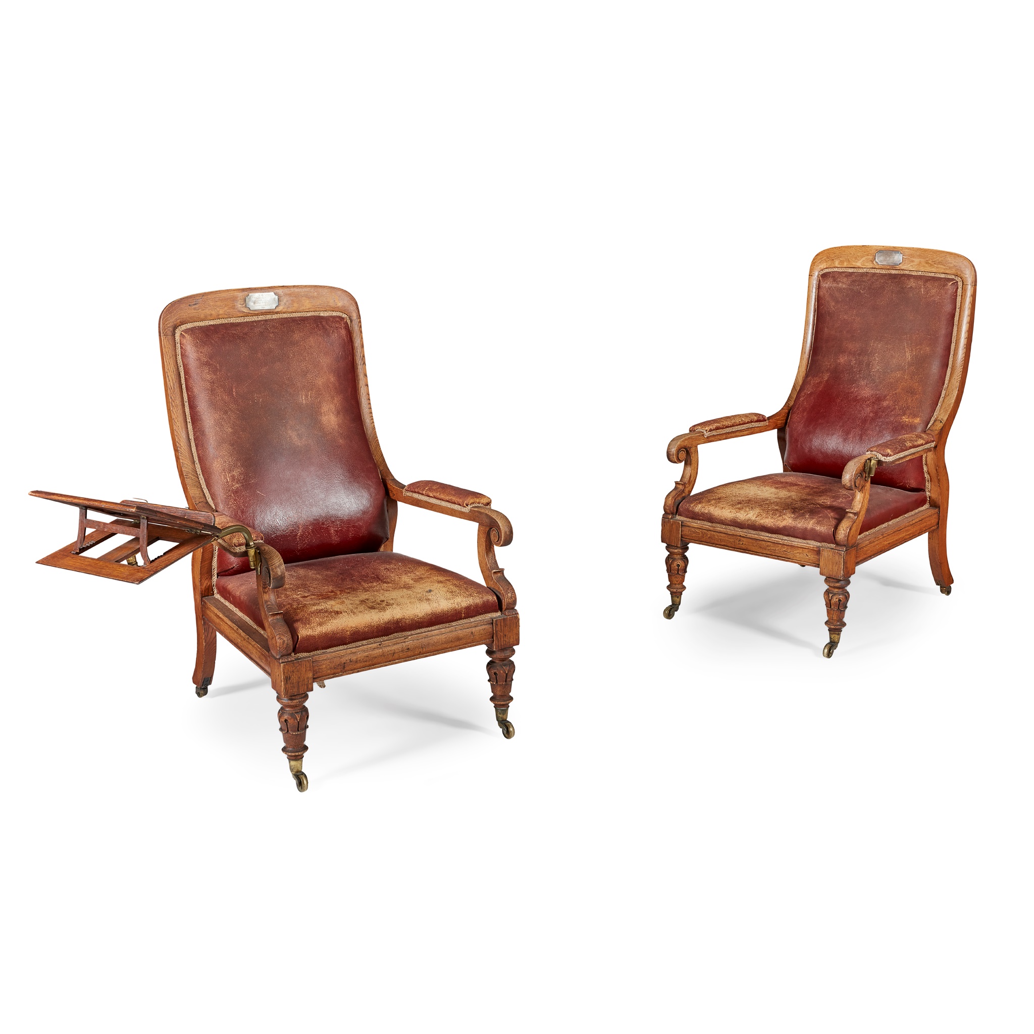 PAIR OF EARLY VICTORIAN OAK FRAMED AND LEATHER UPHOLSTERED LIBRARY ARMCHAIRS