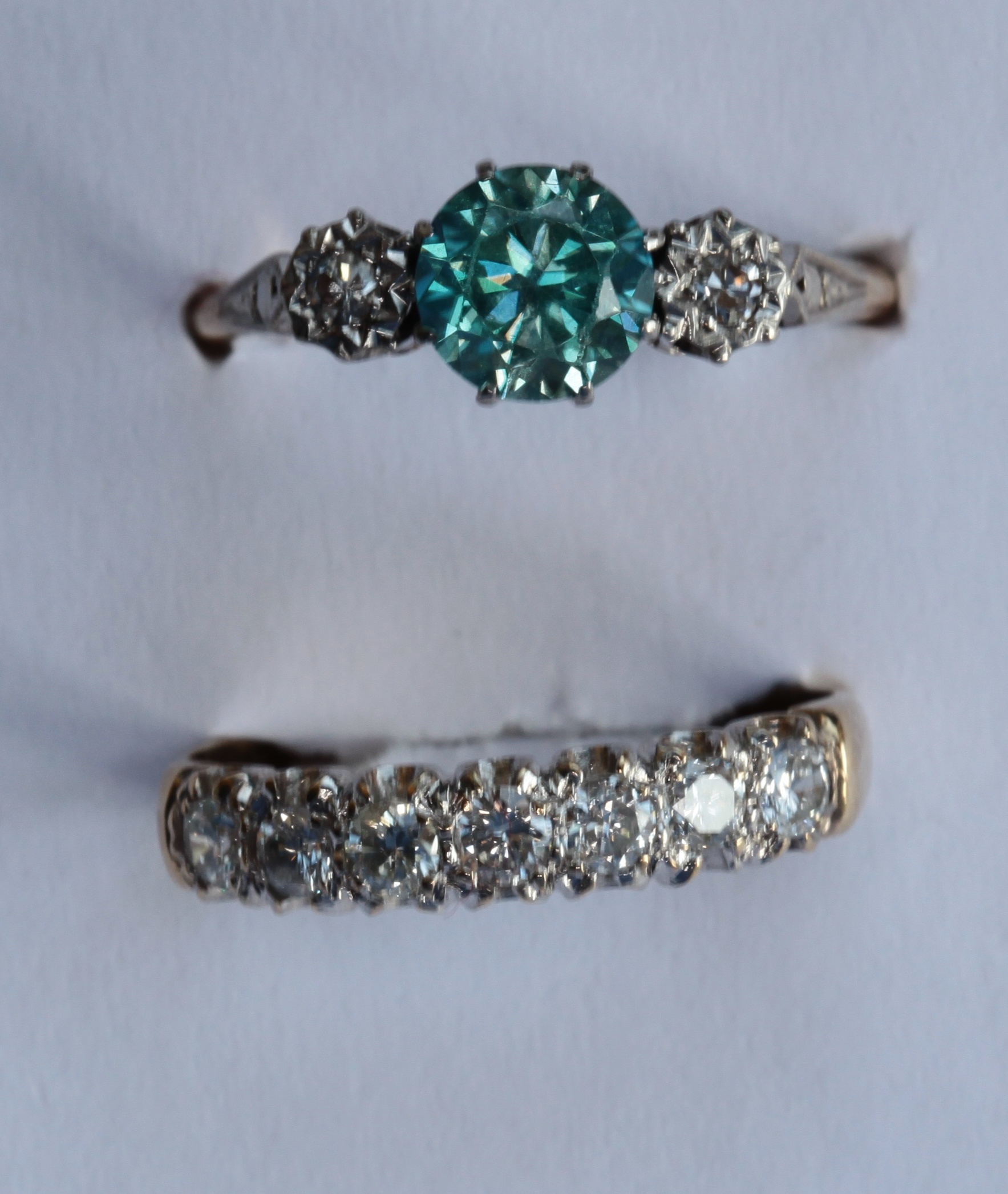 A 9ct gold mounted diamond set half-eternity ring and another ring