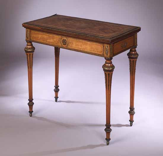 A gilt bronze satinwood and parquetry games table