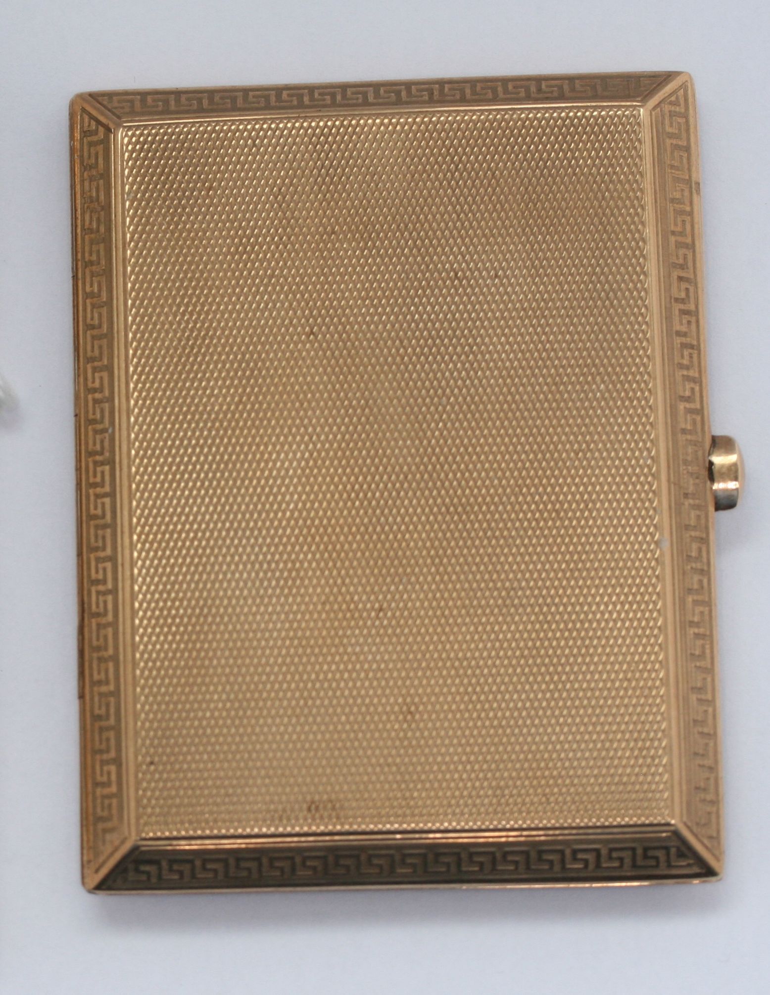 A 9ct gold cigarette case