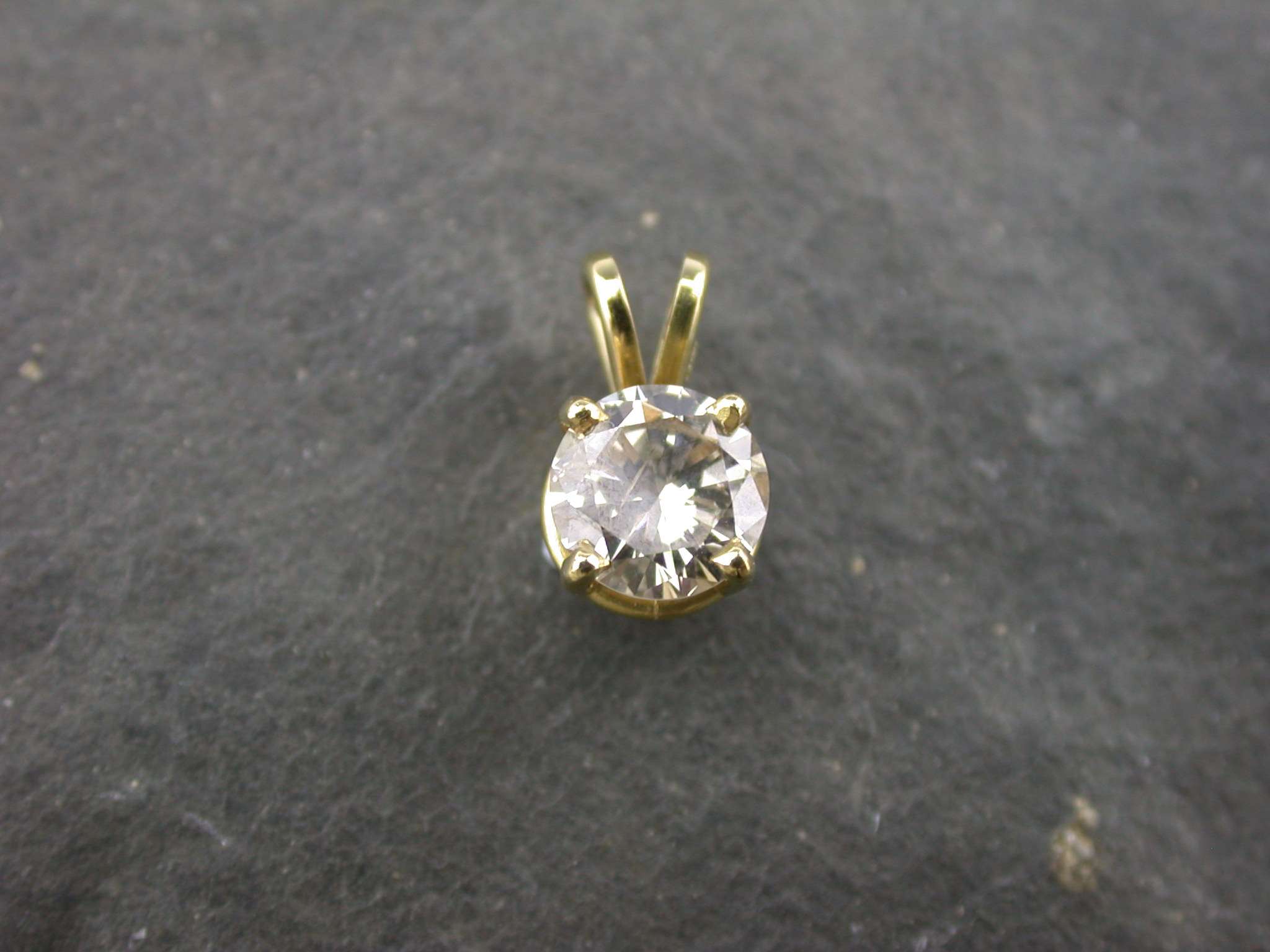 A diamond single stone pendant,