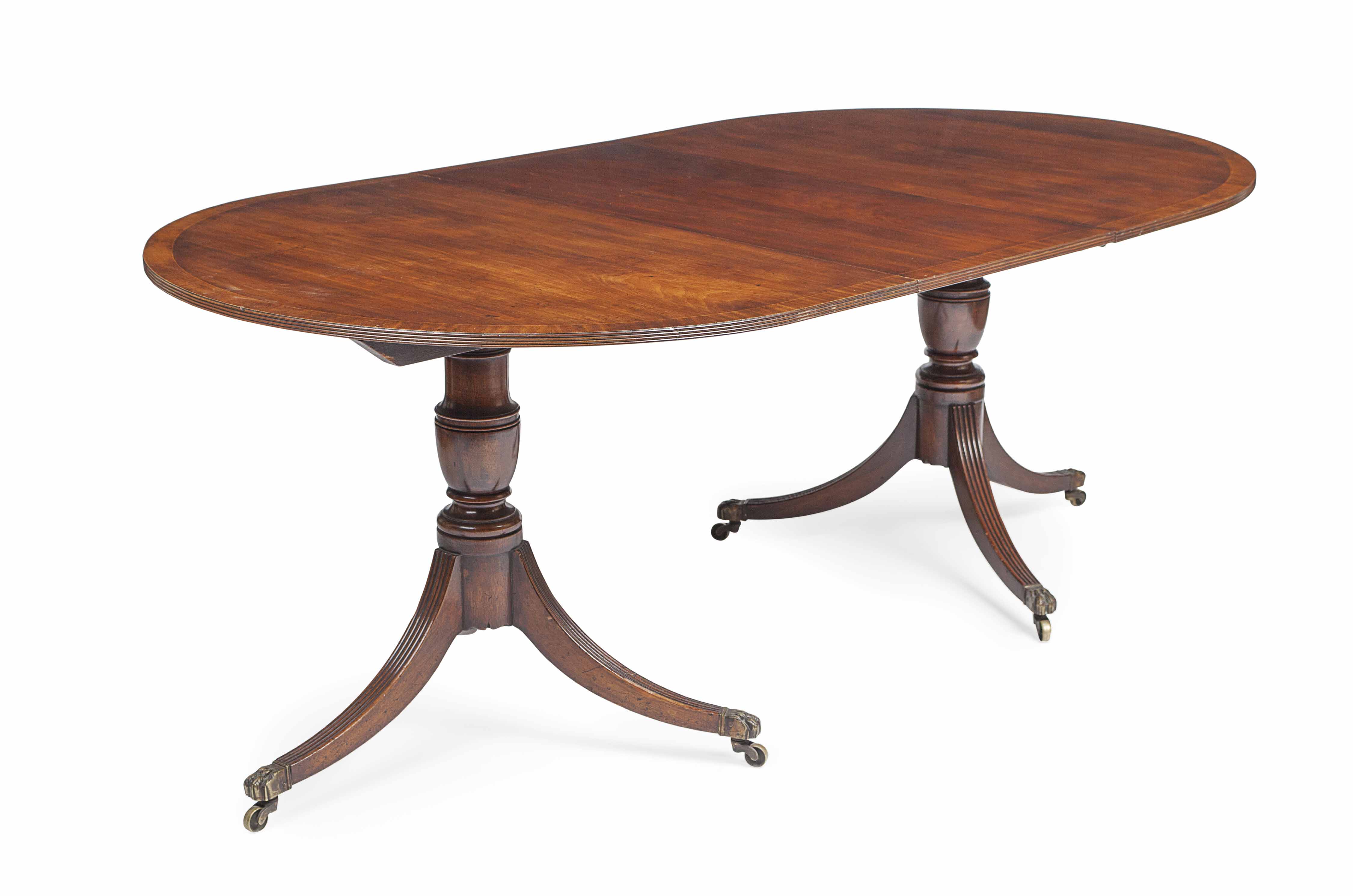 REGENCY STYLE MAHOGANY AND CROSSBANDED PEDESTAL DINING TABLE