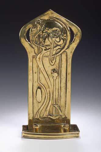 A Scottish Arts & Crafts brass candle sconce by Agnes Bankier Harvey,