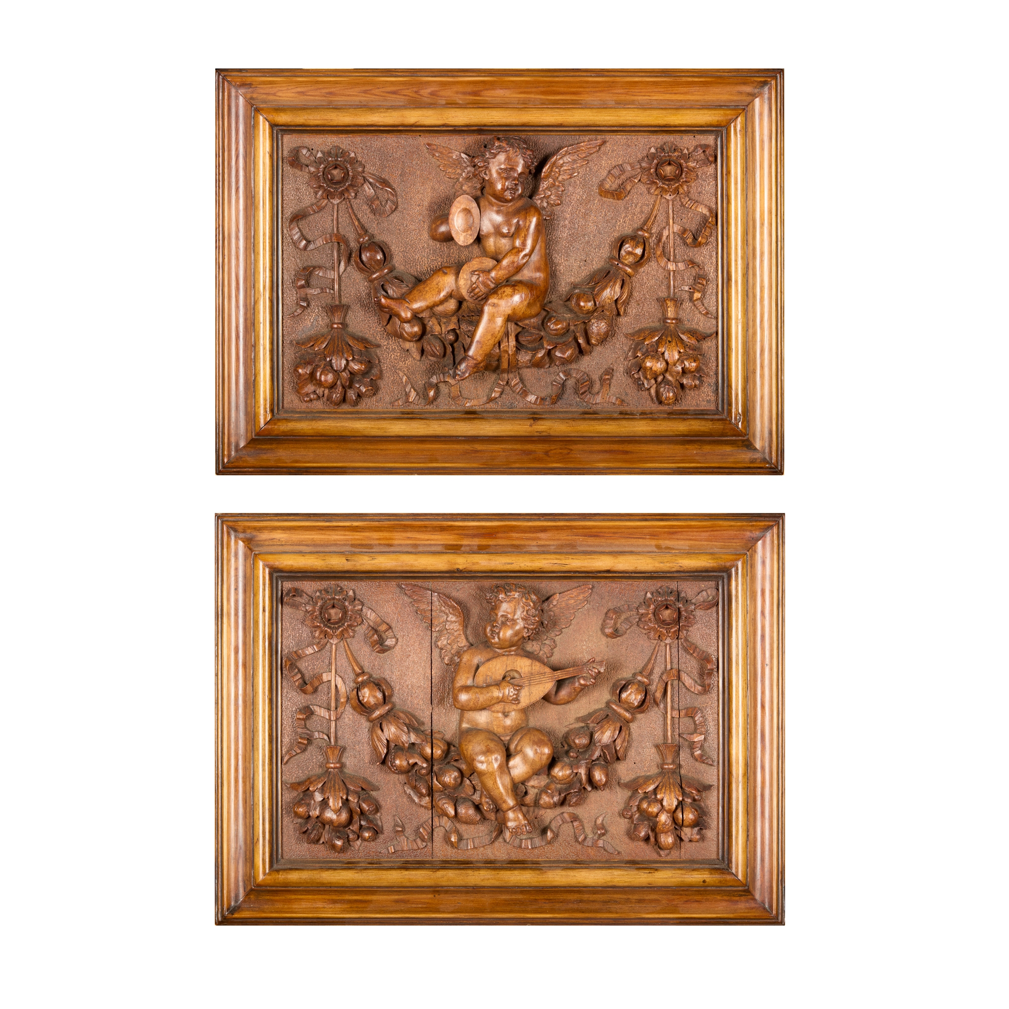 PAIR OF CARVED WOOD PANELS OF MUSICAL PUTTI