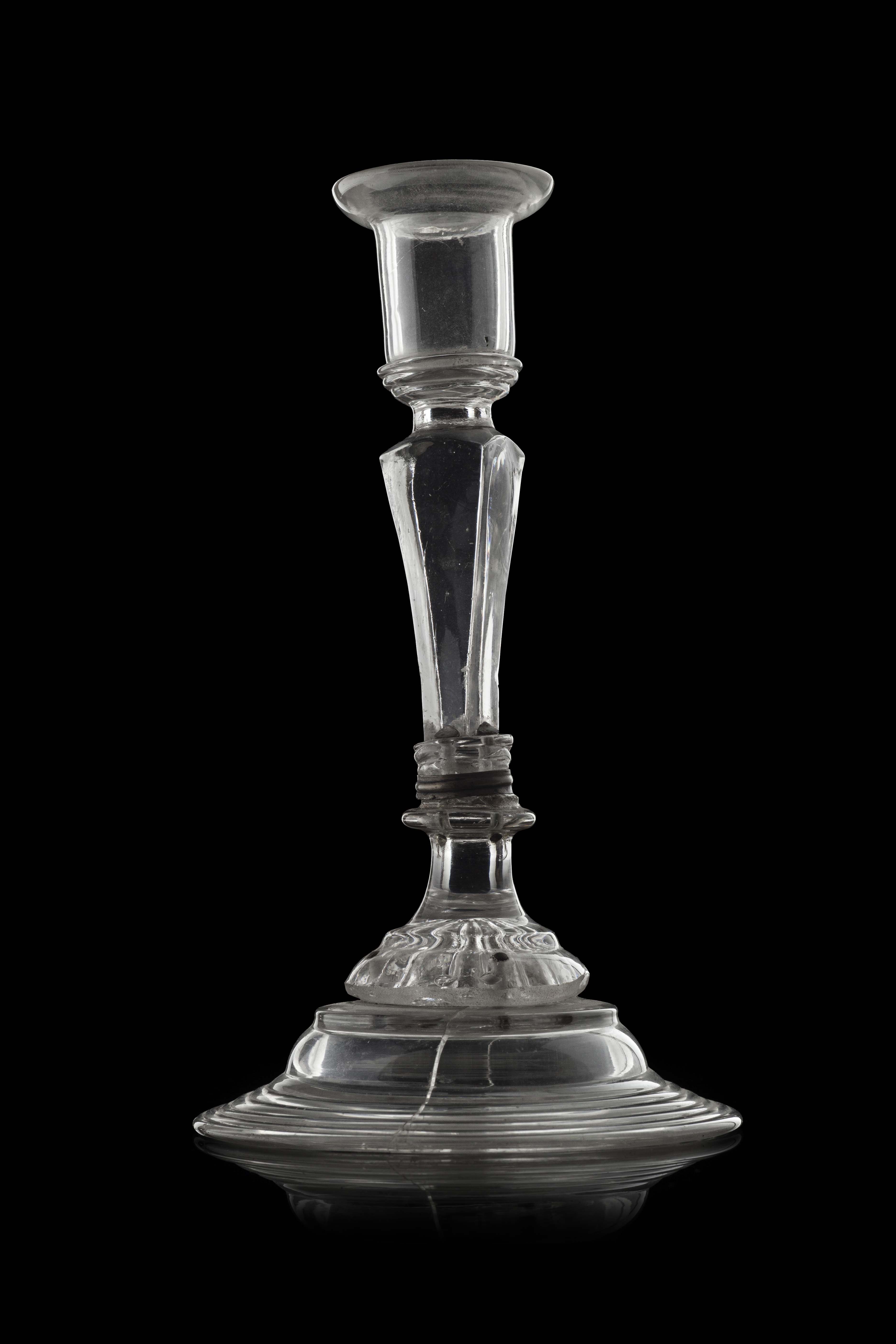 An early 18th century glass candlestick