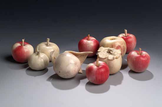 Two joined Japanese carved ivory exotic fruits