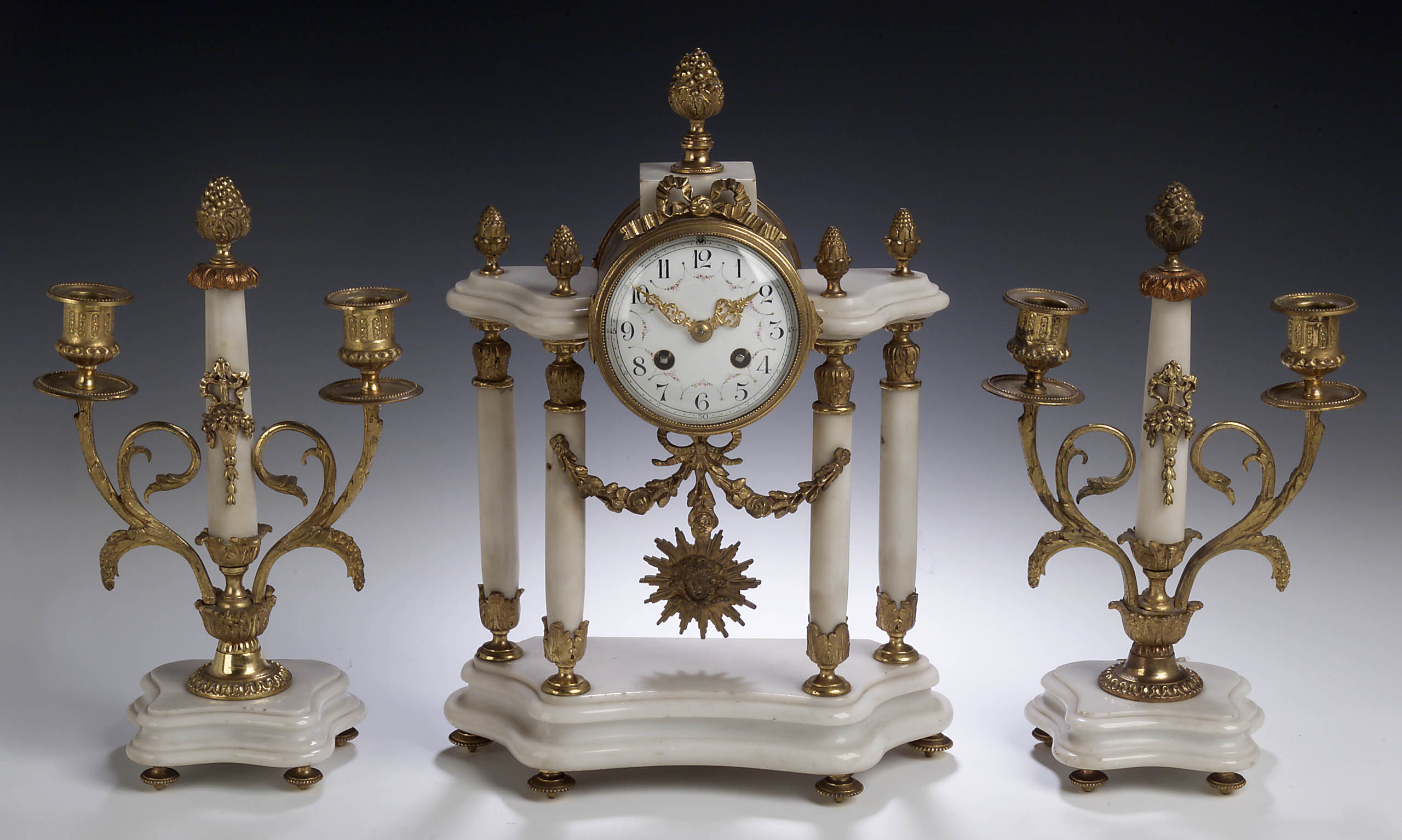A 19th century white marble and gilt metal mounted clock garniture