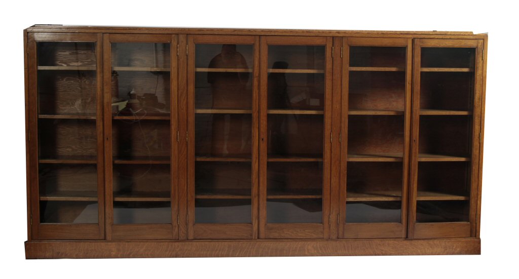 An early/ mid 20th century oak glazed bookcase