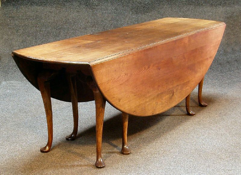 A large oak drop leaf 'Wake' table, in the George III manner