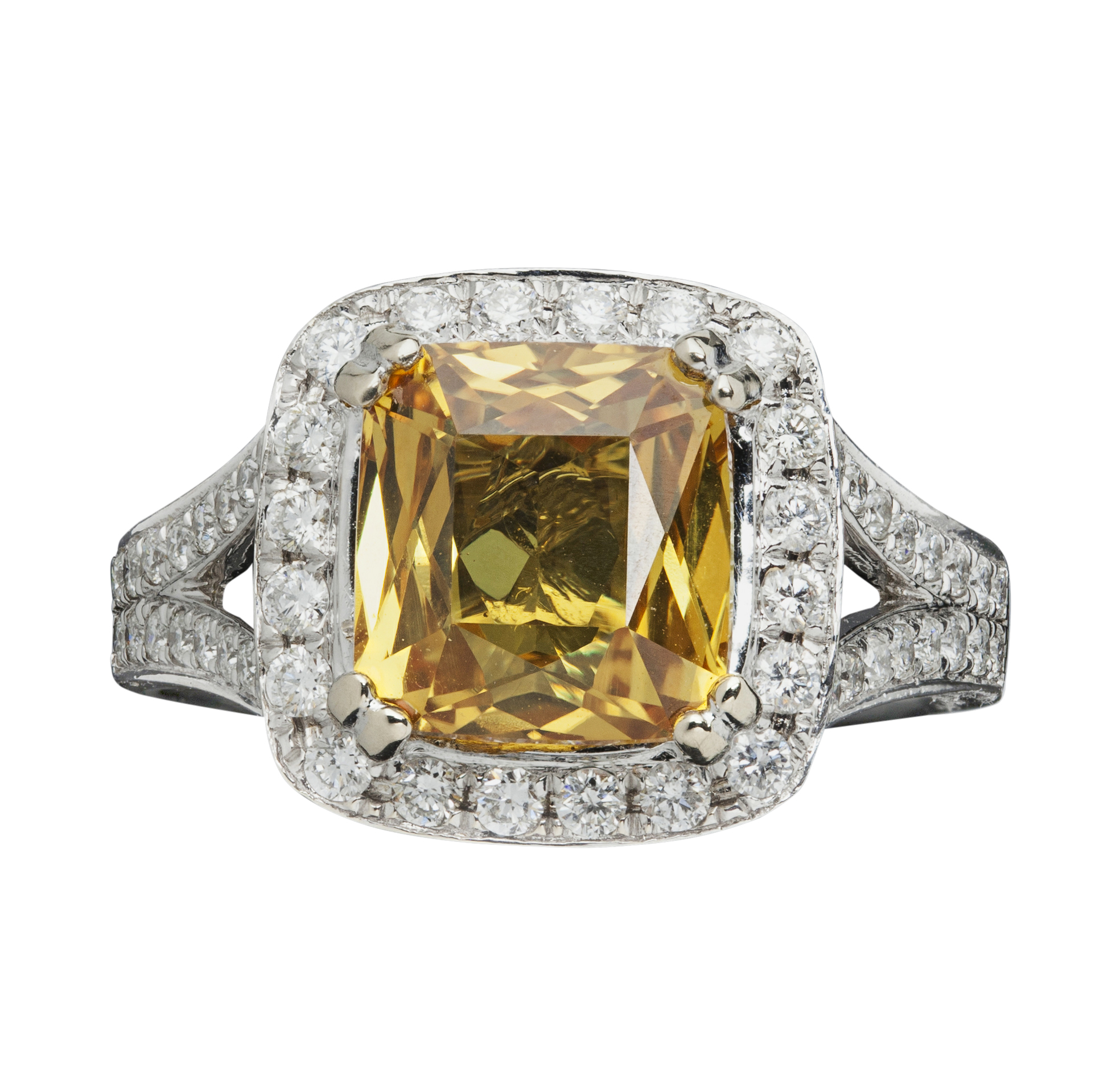 A yellow sapphire and diamond set ring
