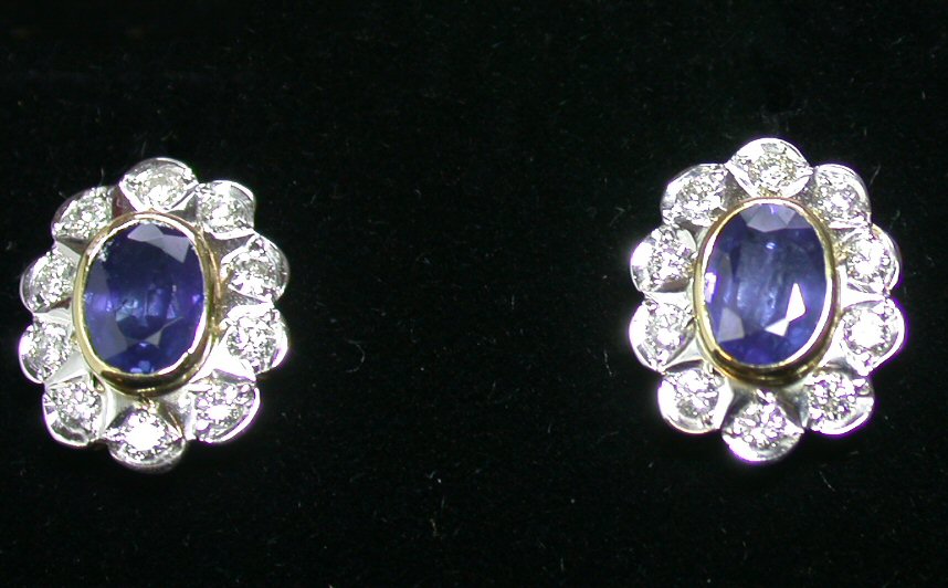 A pair of 18ct gold mounted sapphire and diamond earrings,