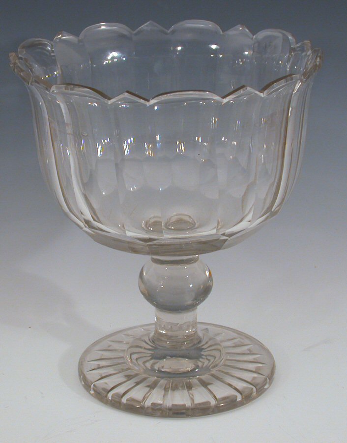 A large Regency scalloped footed bowl