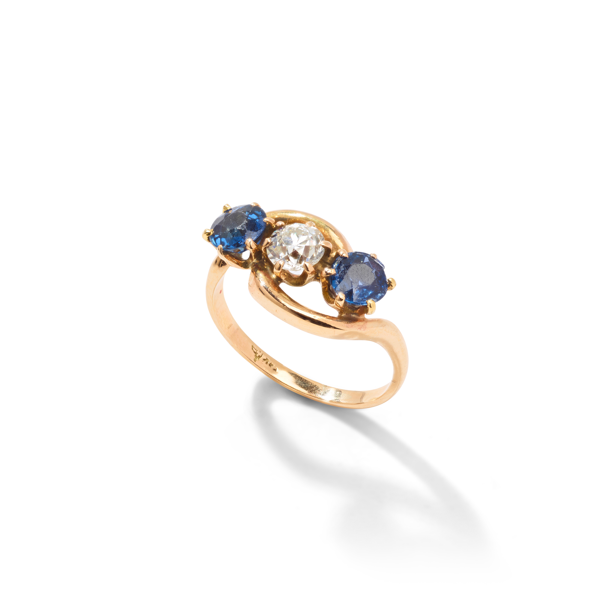 A sapphire and diamond three-stone ring