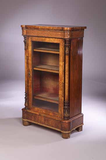 A Victorian walnut veneered music cabinet