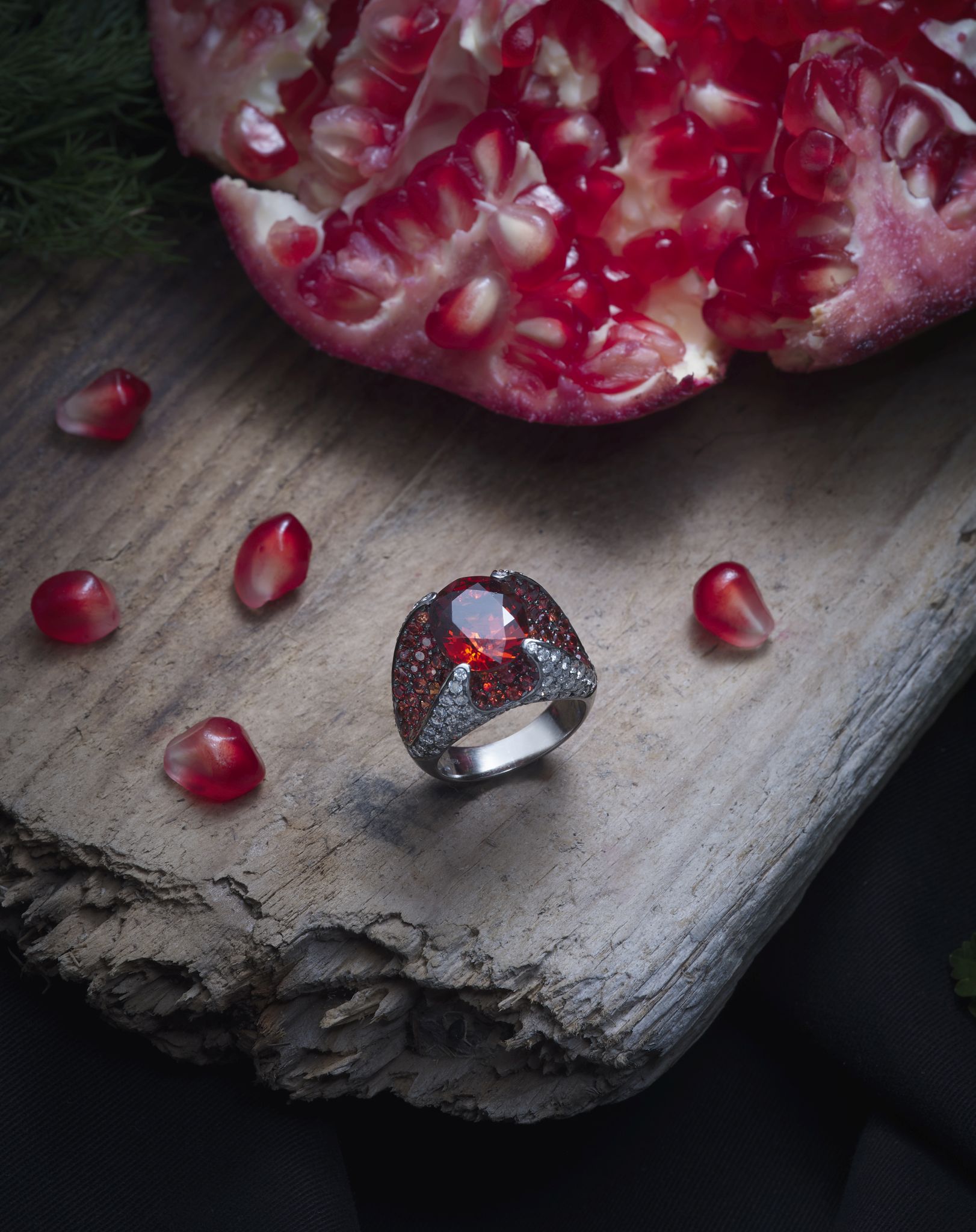 Kutchinksy: A garnet and diamond dress ring